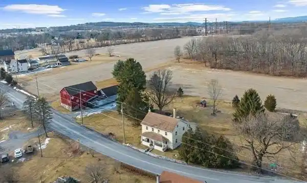 PRIME LAND FEATURING A CLASSIC COLONIAL FARMHOUSE