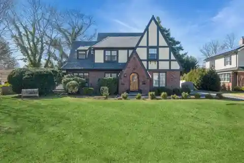Cathedral Gardens Stately Tudor Style Home