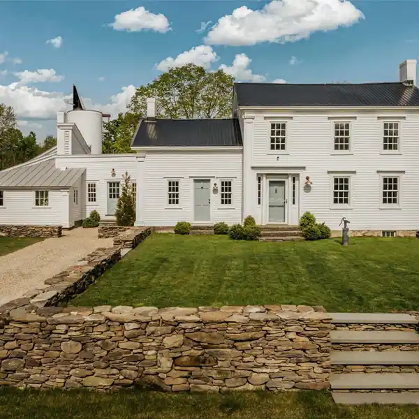 EXCEPTIONAL GREEK REVIVAL FARMHOUSE REIMAGINED