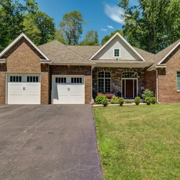CUSTOM BRICK BEAUTY WITH BACKYARD VACATION OASIS