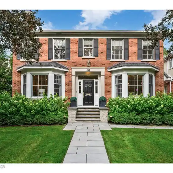 CHARMING BRICK HOME SET ON BEAUTIFULLY LANDSCAPED GROUNDS