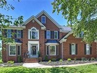 BEAUTIFUL BRICK HOME OVERLOOKING THE DIVIDE GOLF COURSE