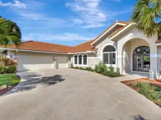Sophisticated Residence in the Coveted Banyan Lakes Gated Community