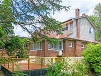 DELIGHTFUL TWO STOREY HOME IN A PRIVATELY ELEVATED SETTING
