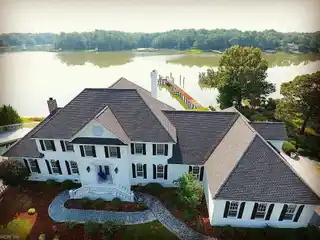 Spectacular Residence Privately Situated on Gated Peninsula Lot
