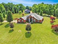 CUSTOM BRICK HOME ON JUST UNDER 100 ACRES