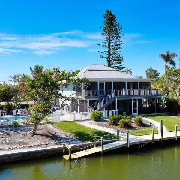 ELEVATED CANAL-FRONT POOL HOME