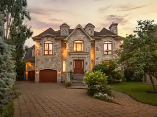 Sophisticated Stone-Front Residence with Gym and Sauna