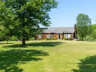 Cedar-sided Traditional Home on 23 Acres