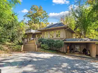 Curved Cabinetry and Marble Floors Throughout