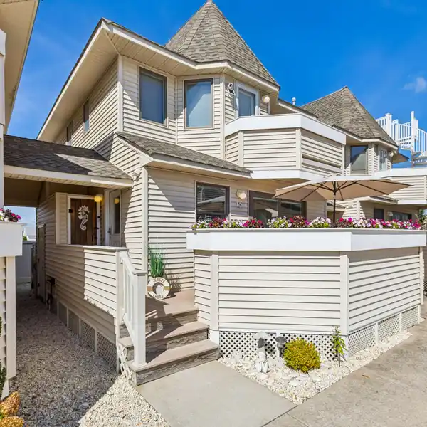 IMMACULATE BEACH RETREAT STEPS FROM THE SAND