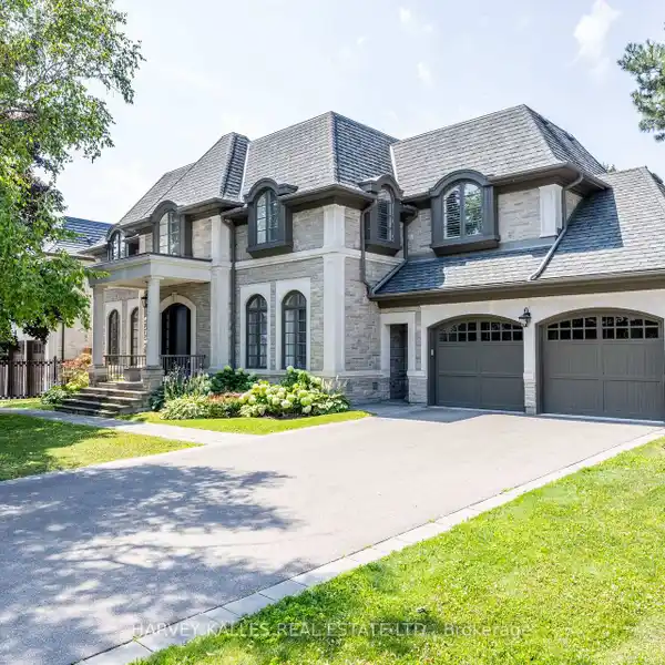 INDIANA LIMESTONE SHOWPIECE WITH DESIGNER INTERIORS & 4-CAR GARAGE