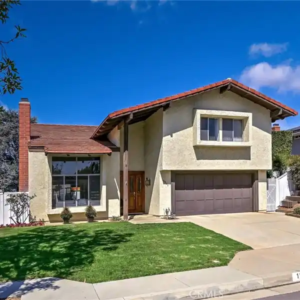 CHARMING HOME WITH BRICK FIREPLACE AND WET BAR