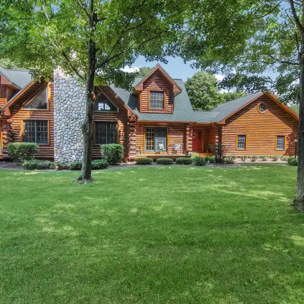 BEAUTIFULLY MAINTAINED LOG-SIDED HOME ON 8.23 ACRES