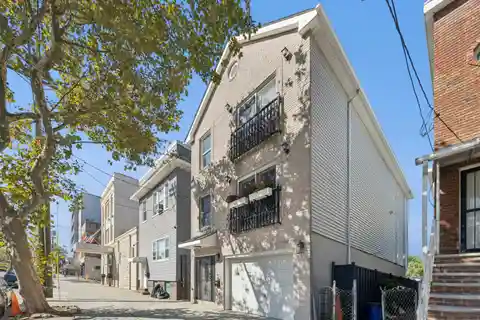 Lovingly Maintained Two-Family Townhouse in the Heart of Jersey City Heights