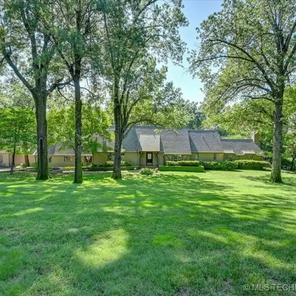 SPRAWLING ENGLISH-INSPIRED HOME IN A TREASURED NEIGHBORHOOD