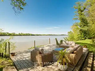Vast Stone House Nestled on the Banks of a River