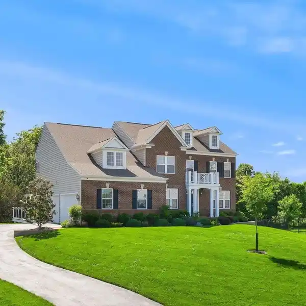 SUN-FILLED COLONIAL ON PRIVATE WOODED LOT