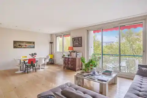 Bright Seine-View Apartment with Continuous Balcony Charm