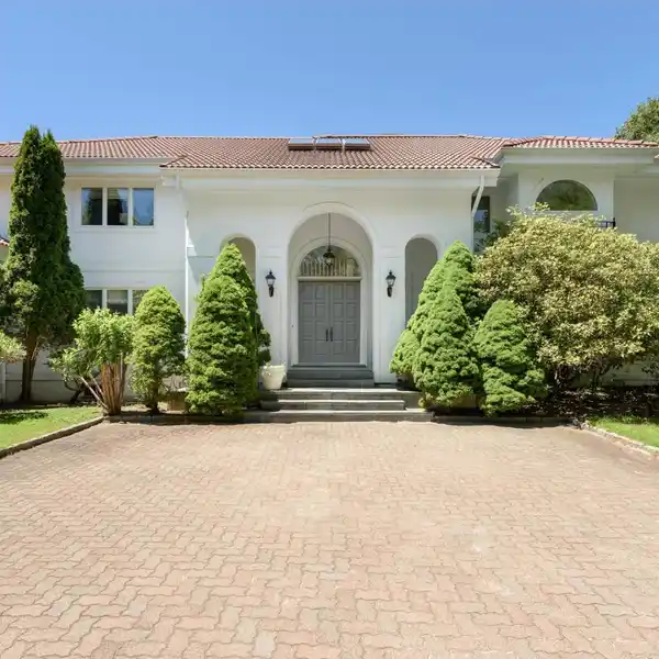 GORGEOUS WHITE STUCCO HOME ON OVER TWO ACRES