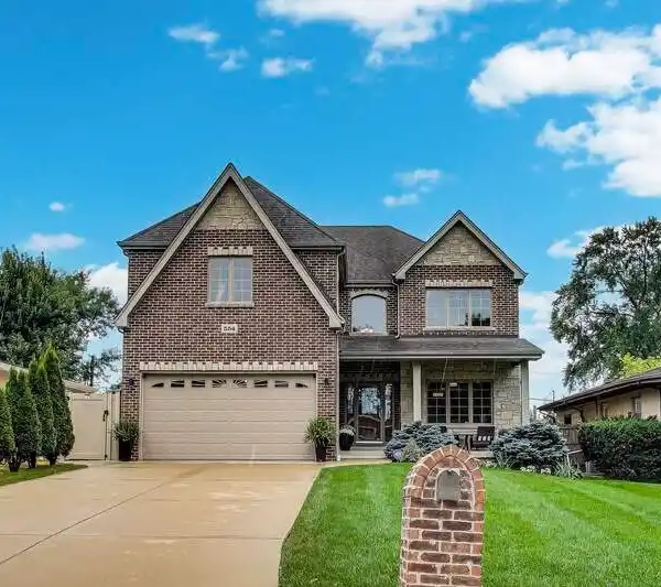 SPACIOUS BRICK HOME WITH LUXURIOUS UPGRADES