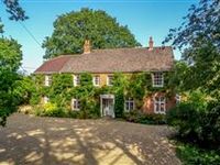 A HANDSOME COUNTRY PROPERTY WITH SPLENDID, FAR-REACHING GARDENS AND GROUNDS