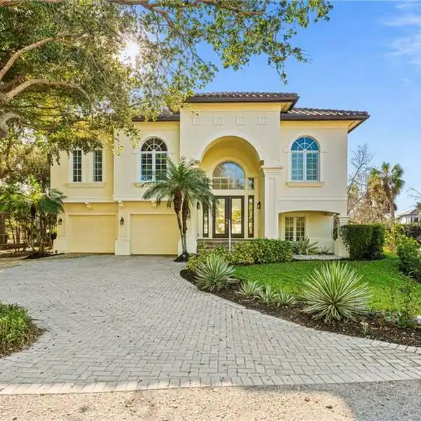 TWO-STORY CORNER HOME OFFERING ENDLESS POTENTIAL