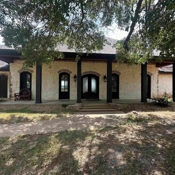 AUSTIN STONE-BUILT HOME ON OVER 200 ACRES
