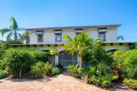 Captivating Home Hidden Behind Lush Plantings