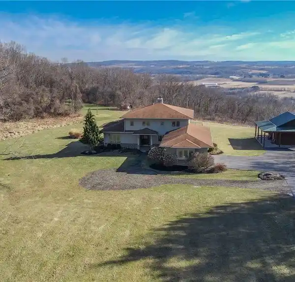 METICULOUSLY CRAFTED HOME ON 40 ACRES