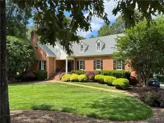 Expansive Brick Beauty with Wooded Backyard Views