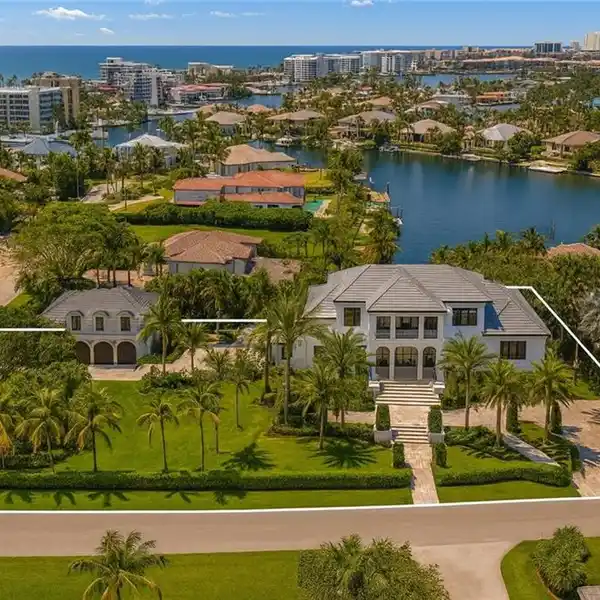 FULLY REIMAGINED ESTATE ON A RARE CORNER WATERFRONT LOT