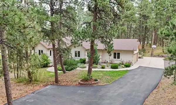 CUSTOM HOME SURROUNDED BY NATURAL BEAUTY
