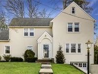 TASTEFULLY RENOVATED AND PRISTINE CENTER HALL COLONIAL
