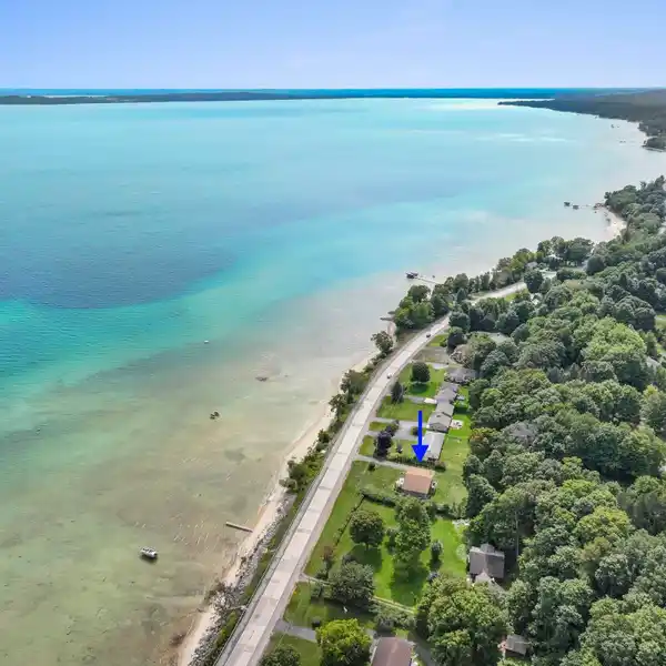 BEAUTIFULLY STYLED RETREAT WITH 100 FEET OF PRIVATE SANDY FRONTAGE