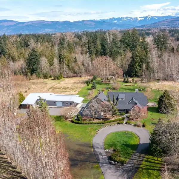 ELEGANT RAMBLER WITH SHOP ON 4.5 ACRES