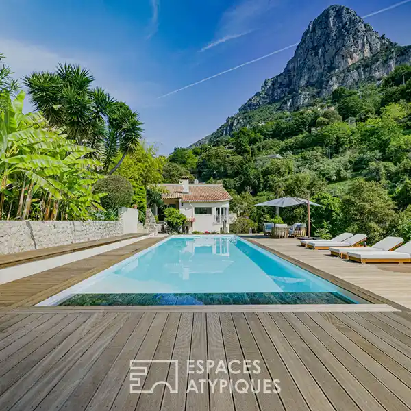 COVERED OUTDOOR DINING AMID TROPICAL PLANTINGS