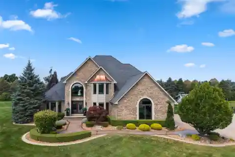 Entertainer’s Dream Home with Heated Garage, Pool & Multiple Gathering Spaces