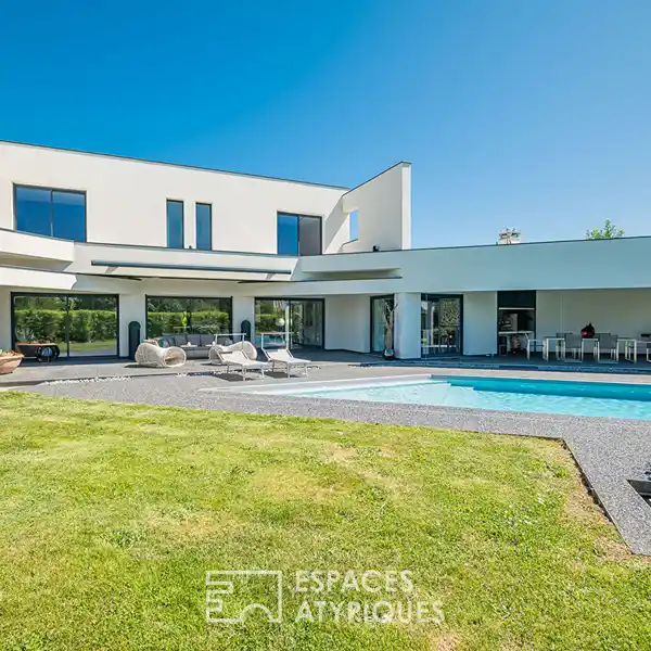 ARCHITECTURAL GEM WITH EXPANSIVE LANDSCAPED GROUNDS