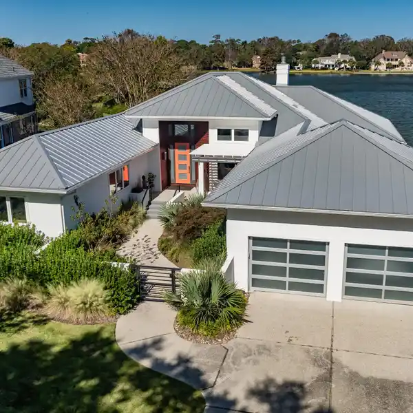 CONTEMPORARY LUXURY  HOME IN THE PRESTIGIOUS LAKESIDE VILLAS OF LANDFALL