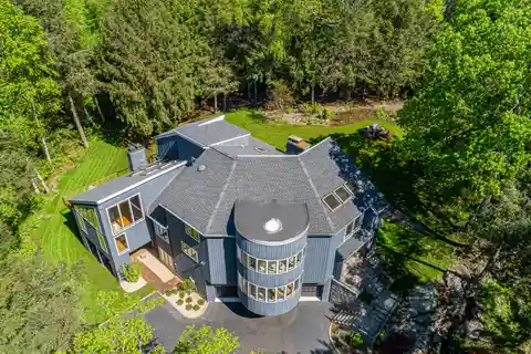 Contemporary Elegance Meets Peaceful Wooded Retreat