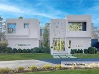 STRIKING THREE-LEVEL MODERN HOME
