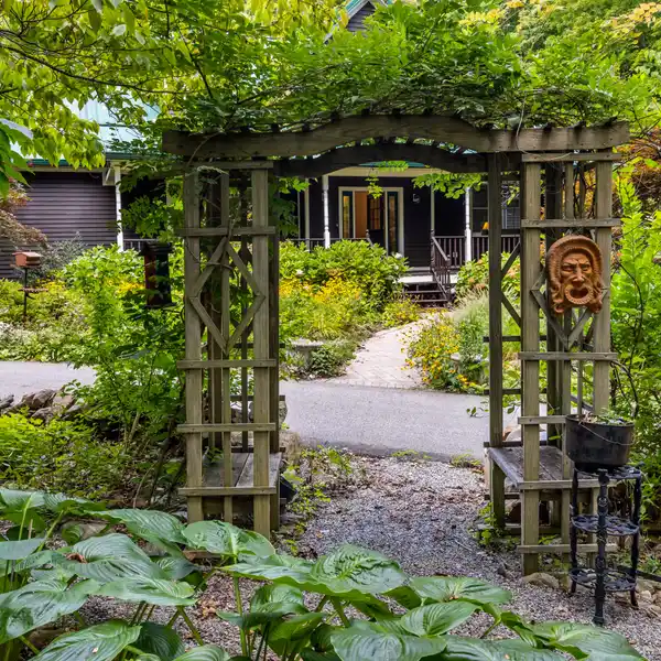 PRIVATE BUCOLIC RETREAT TUCKED AWAY ON NEARLY 2 PRISTINE ACRES