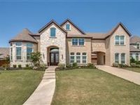 BEAUTIFUL BRICK AND STONE HOME ON LARGE INTERIOR LOT