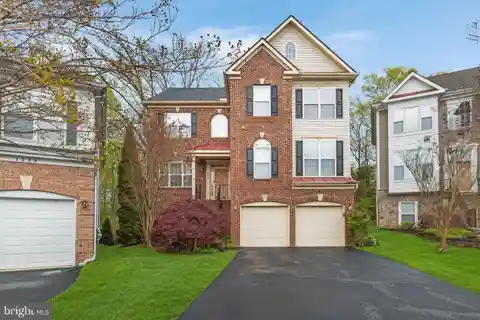 Elegant Brick-front Home with Scenic Backyard