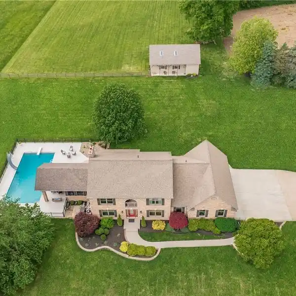 STUNNING BRICK HOMESTEAD WITH HORSE BARN