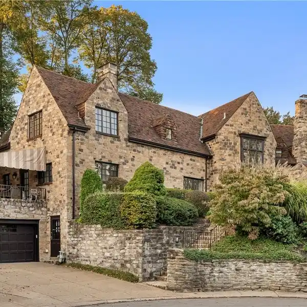 EXQUISITE STONE ESTATE ON A COVETED CUL-DE-SAC