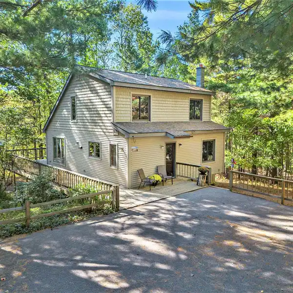 CLASSIC SALTBOX-STYLE HOME NESTLED ON NEARLY 10 ACRES
