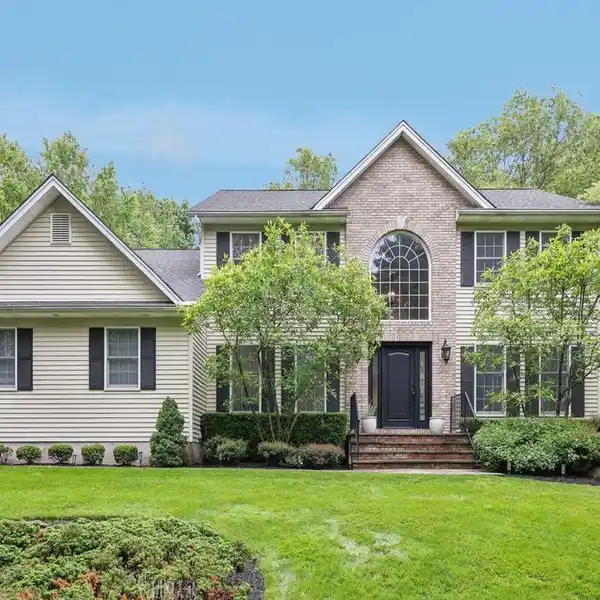 GRAND COLONIAL WITH CUSTOM MILLWORK DETAILS