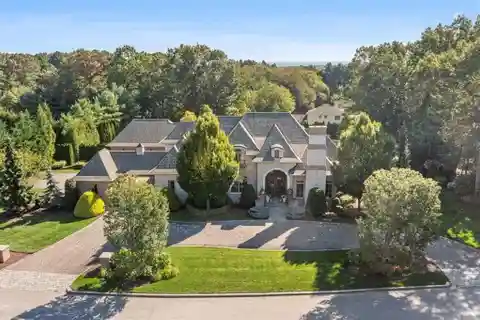 Custom Brick & Stone Masterpiece with 5 Ensuite Bedrooms